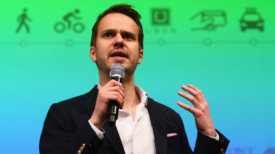Christian Freese speaking on stage at an Uber event